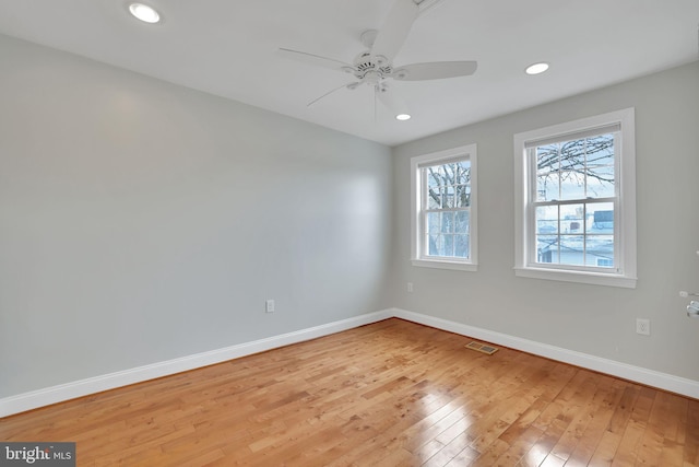 spare room featuring ceiling fan and light wood-type flooring