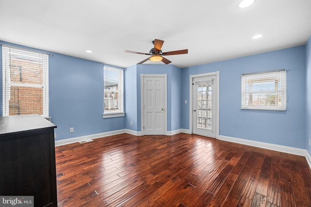 spare room featuring recessed lighting, wood finished floors, visible vents, and baseboards