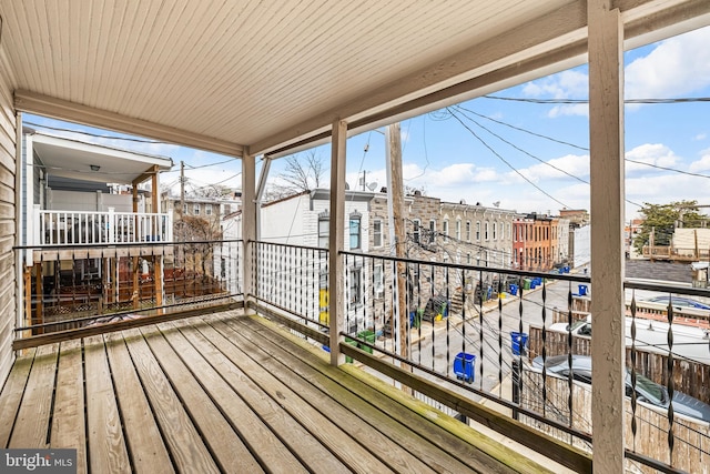 wooden deck with a view of city