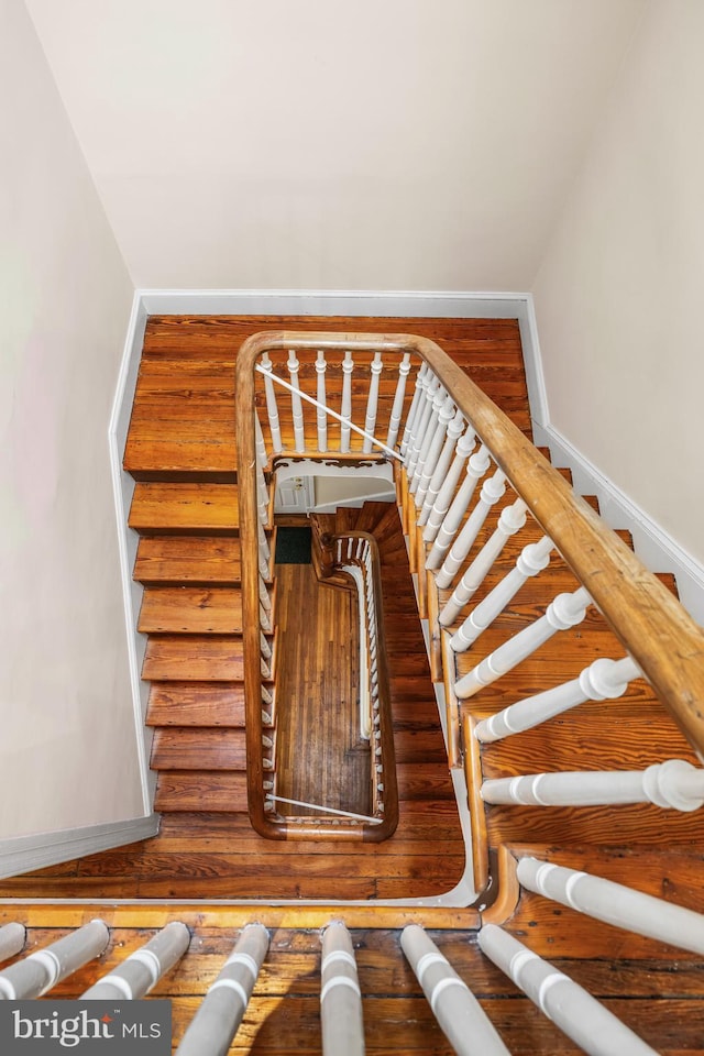 stairway featuring baseboards