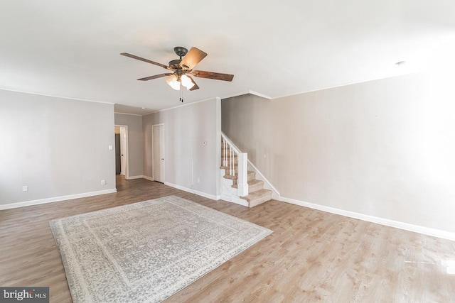 interior space featuring light wood-type flooring and ceiling fan