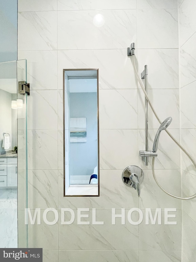 bathroom with a tile shower