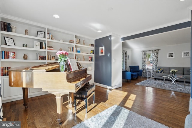 miscellaneous room featuring ornamental molding, dark hardwood / wood-style floors, and built in features