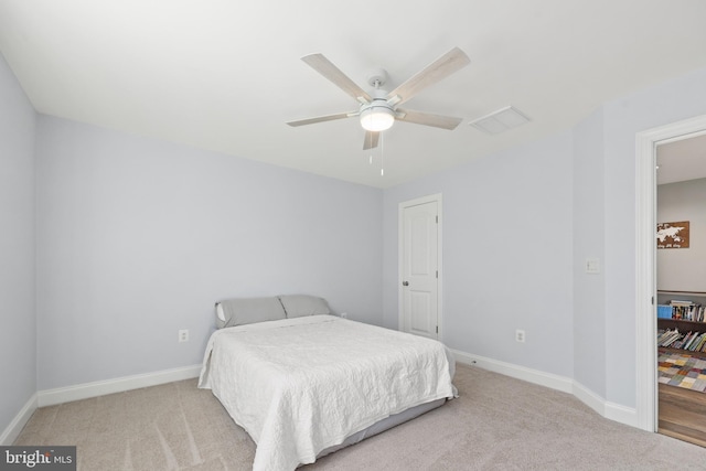 carpeted bedroom featuring ceiling fan