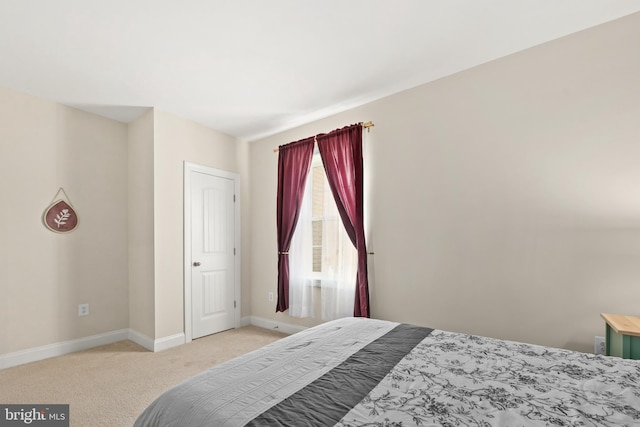 bedroom featuring light carpet