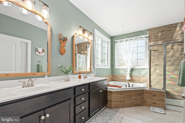 bathroom featuring vanity and separate shower and tub