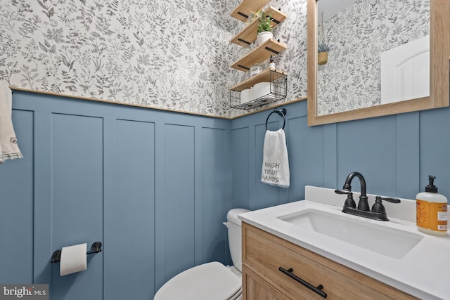 bathroom with vanity and toilet