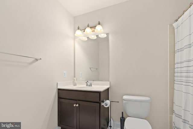 bathroom with vanity, a shower with curtain, and toilet