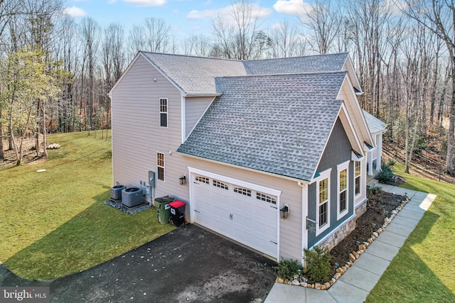 view of property exterior featuring a yard and central AC unit