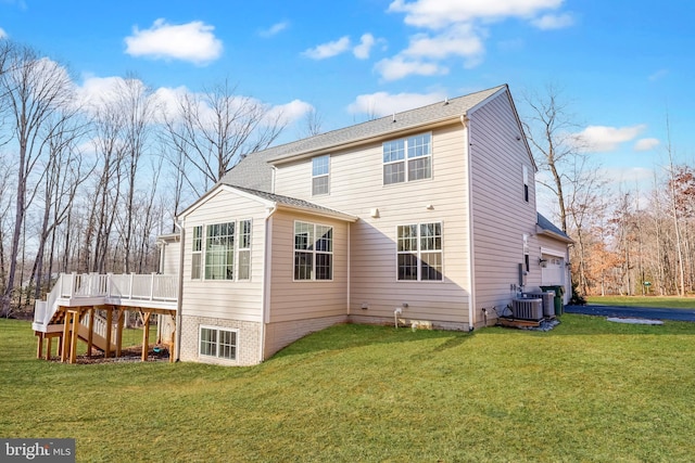 back of house with cooling unit, a wooden deck, and a yard