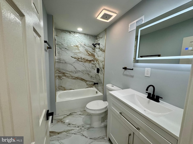 full bathroom with vanity, toilet, and tiled shower / bath