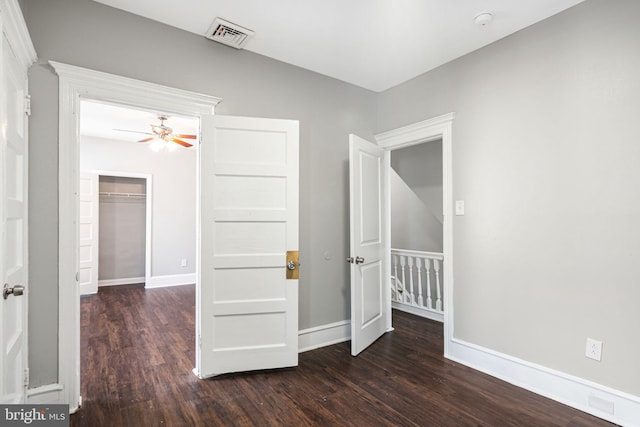 interior space with dark hardwood / wood-style floors and a closet