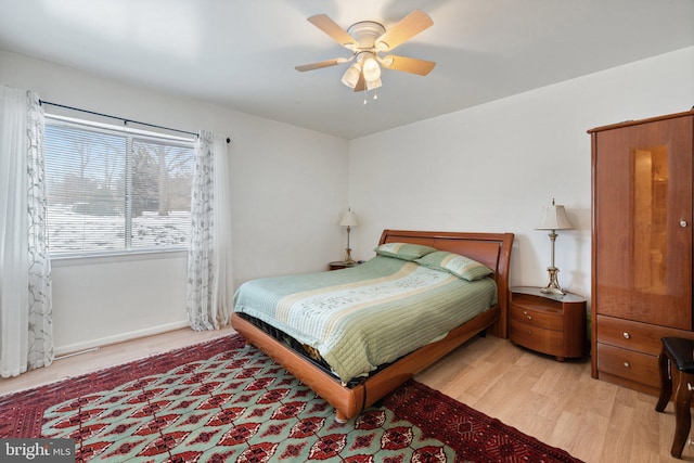 bedroom featuring light wood-type flooring and ceiling fan