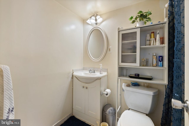 bathroom with toilet and vanity