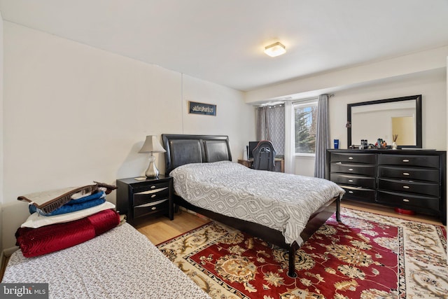 bedroom with light hardwood / wood-style floors