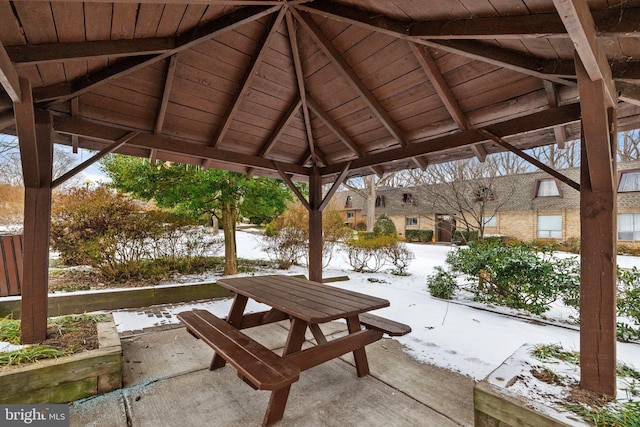 snow covered patio with a gazebo