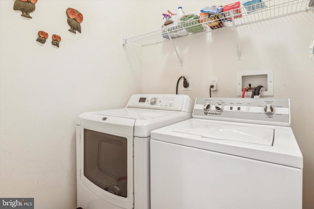 laundry room with washing machine and clothes dryer