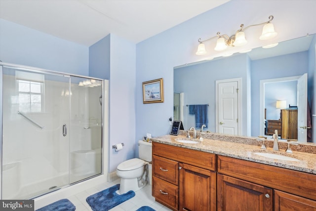 bathroom with vanity, tile patterned floors, toilet, and walk in shower