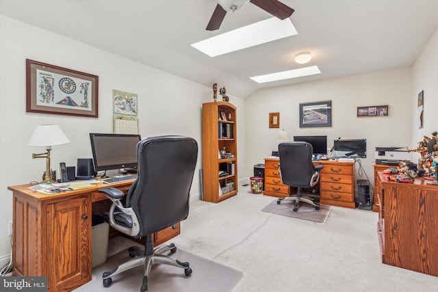 office area featuring vaulted ceiling and light colored carpet