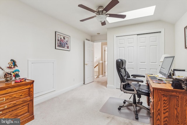 office area featuring light carpet and ceiling fan