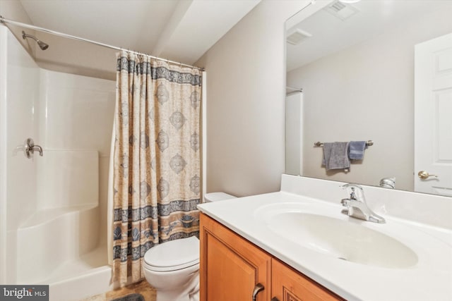 bathroom with vanity, toilet, and walk in shower