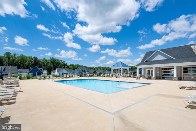 view of swimming pool featuring a gazebo and a patio area