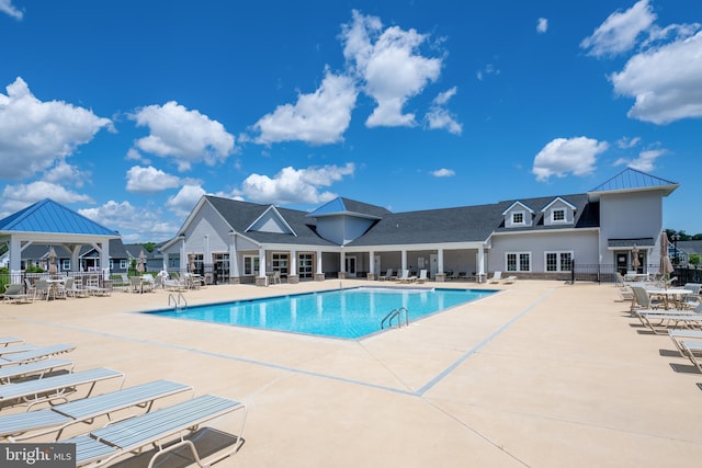 view of swimming pool featuring a gazebo and a patio