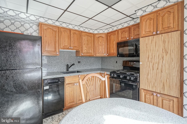 kitchen featuring sink and black appliances