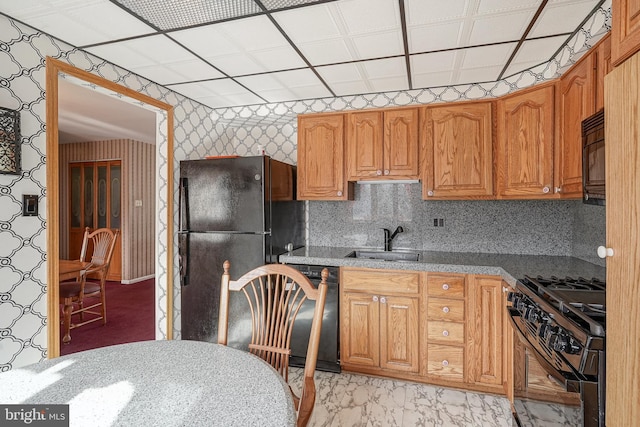 kitchen with sink and black appliances