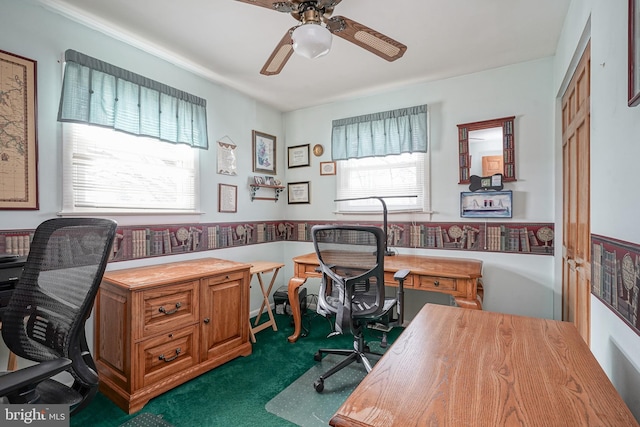 carpeted home office with ceiling fan