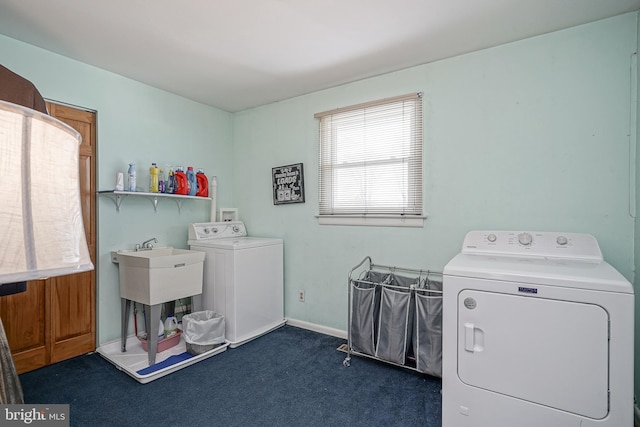 laundry area featuring washing machine and clothes dryer and dark colored carpet