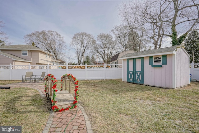 view of yard with a shed and a patio