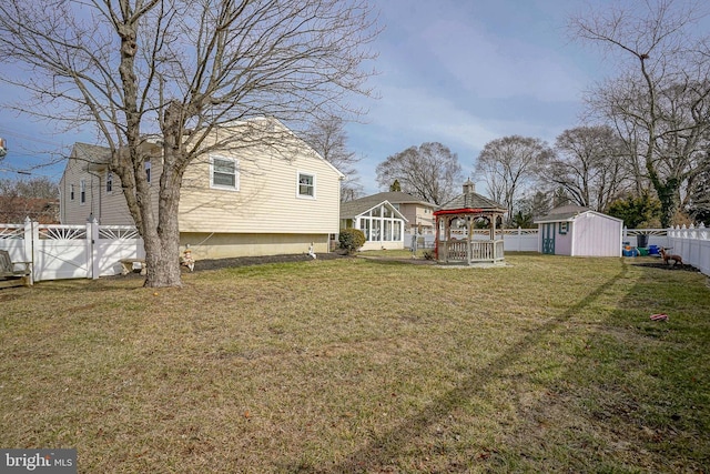 view of yard featuring a gazebo and a shed