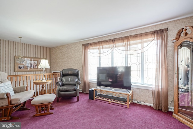 sitting room featuring carpet flooring