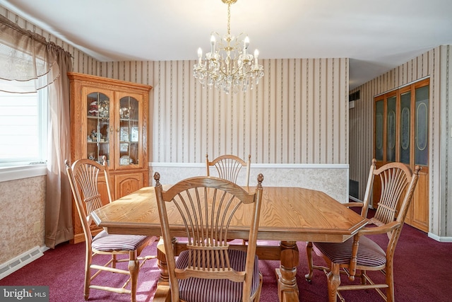 carpeted dining area with an inviting chandelier and a baseboard radiator