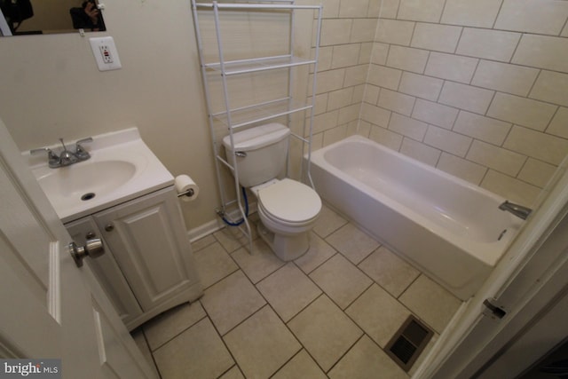 full bathroom with vanity, toilet, tiled shower / bath combo, and tile patterned flooring