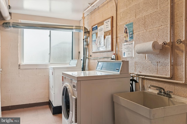 laundry area with sink and washer and dryer