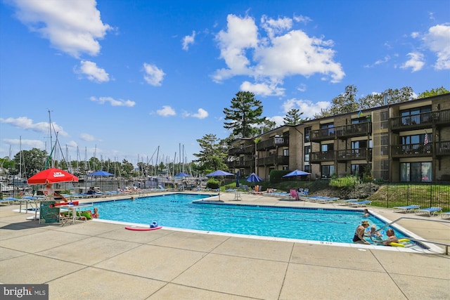 view of swimming pool with a patio