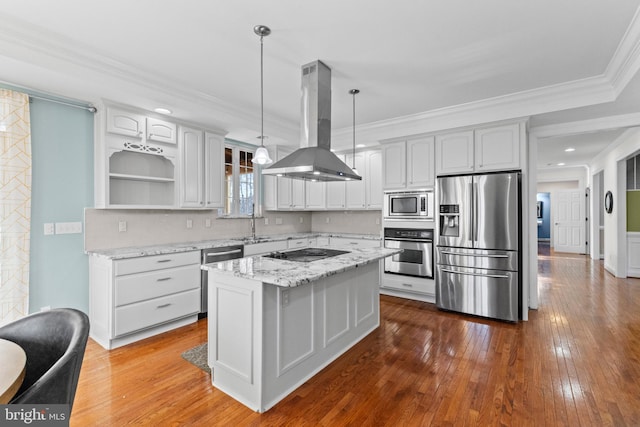 kitchen with light stone counters, island range hood, a center island, appliances with stainless steel finishes, and pendant lighting