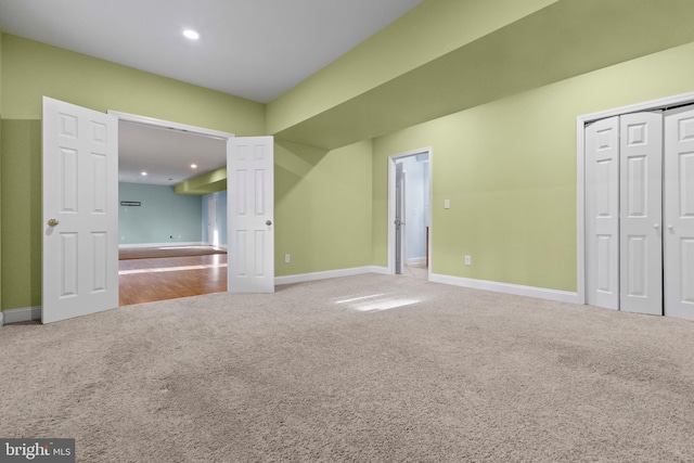 unfurnished bedroom with carpet floors and a closet