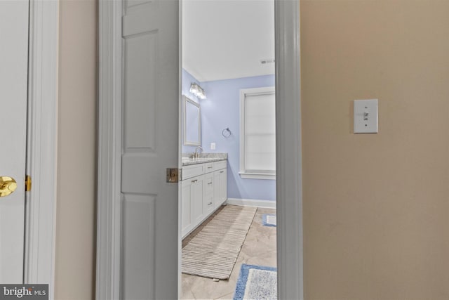 bathroom with vanity and tile patterned floors