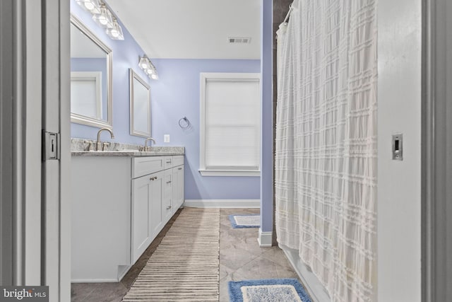 bathroom with vanity and a shower with curtain