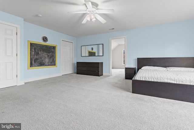 carpeted bedroom featuring ceiling fan and a closet