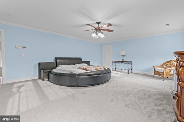 bedroom with ceiling fan, ornamental molding, and light carpet