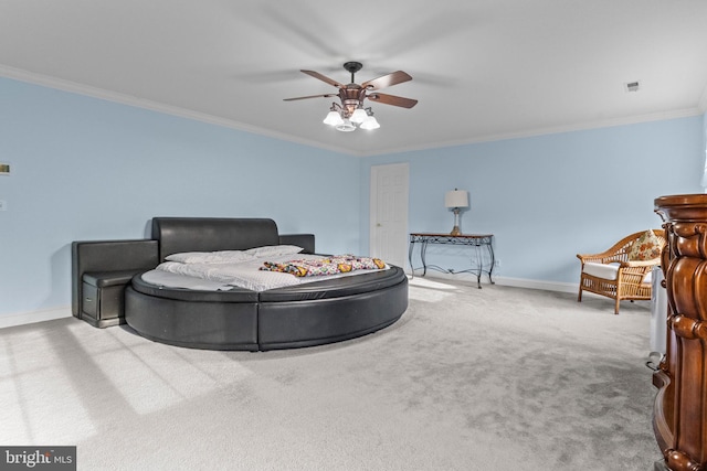 bedroom featuring ceiling fan, ornamental molding, and carpet