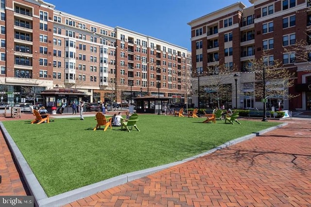 view of property's community with a lawn