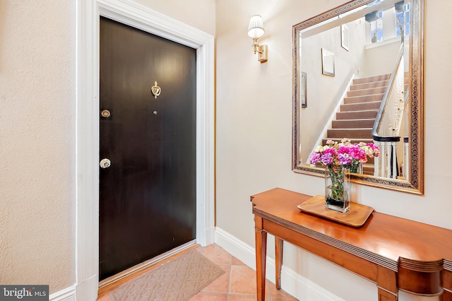 view of tiled foyer entrance