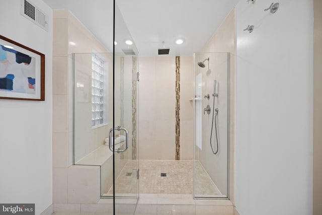 full bath with visible vents and a stall shower