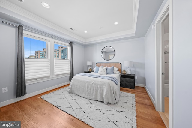 bedroom featuring visible vents, baseboards, ornamental molding, recessed lighting, and light wood-style floors