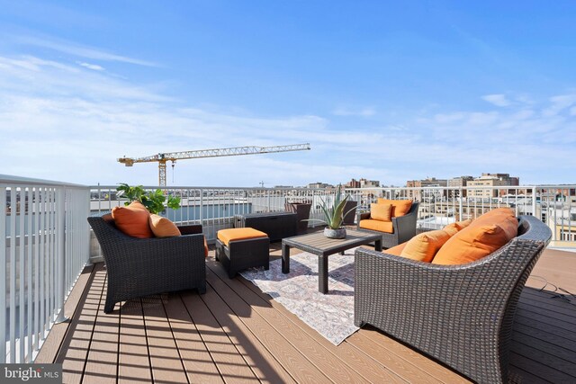 deck featuring a city view and an outdoor hangout area